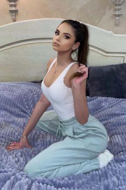 maslak escort sitting on bed